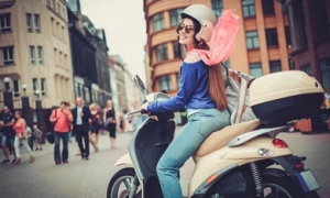 Girl on a scooter smiling